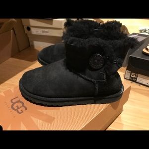 Black classic UGG winter boots.